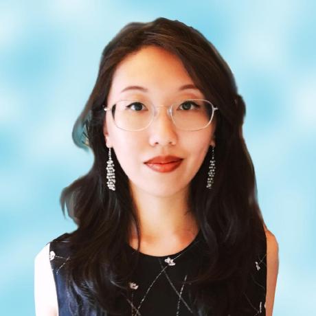 Photo of an asian woman wearing glasses and a black sleeveless tank top with tiny flowers, blue background